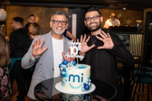 Sandeep Kumar and Rahil Kumar smile while celebrating 10 years of MiSmile.