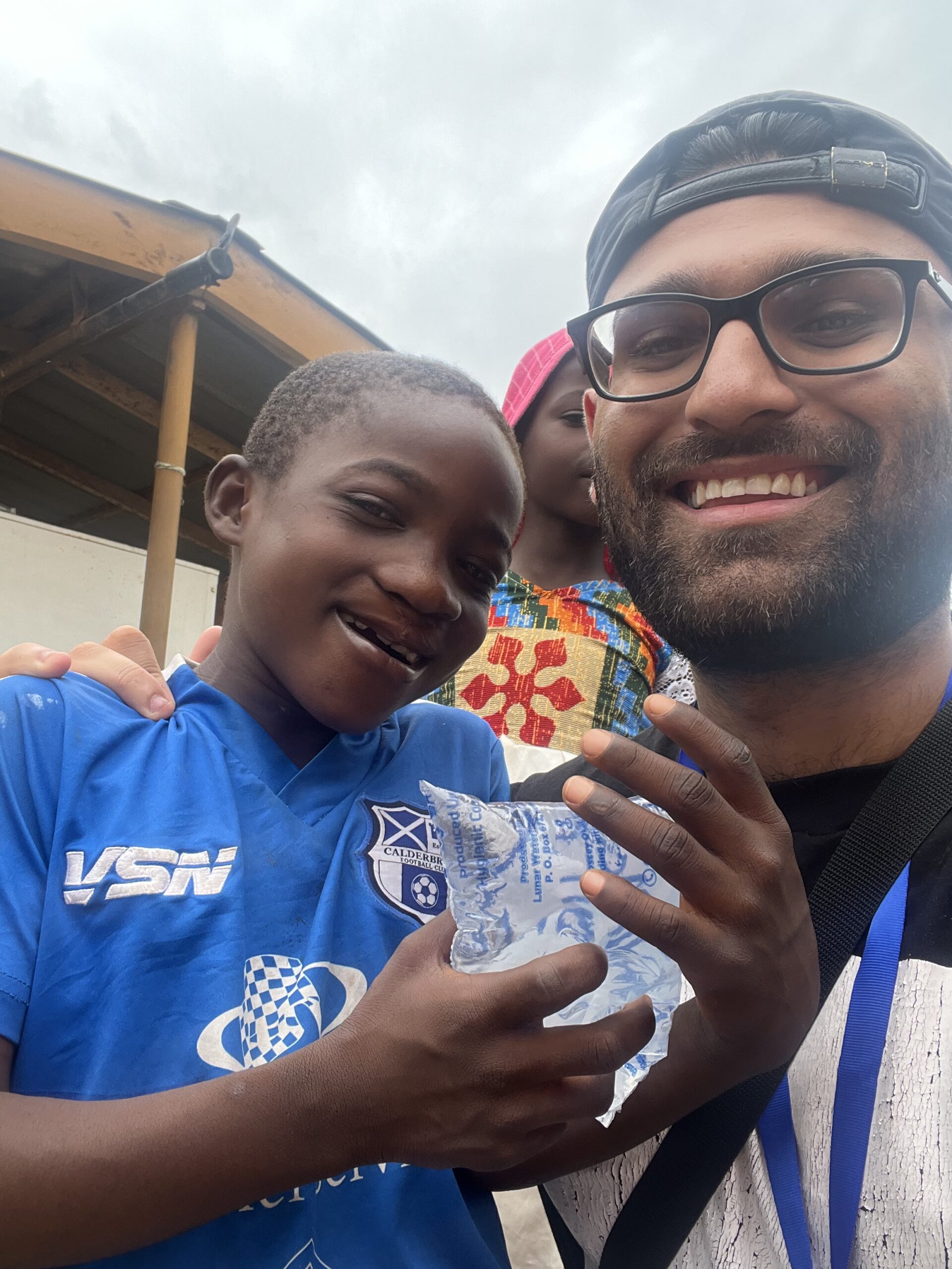 Rahil with one of the children at the Operation Smile Ghana screening day