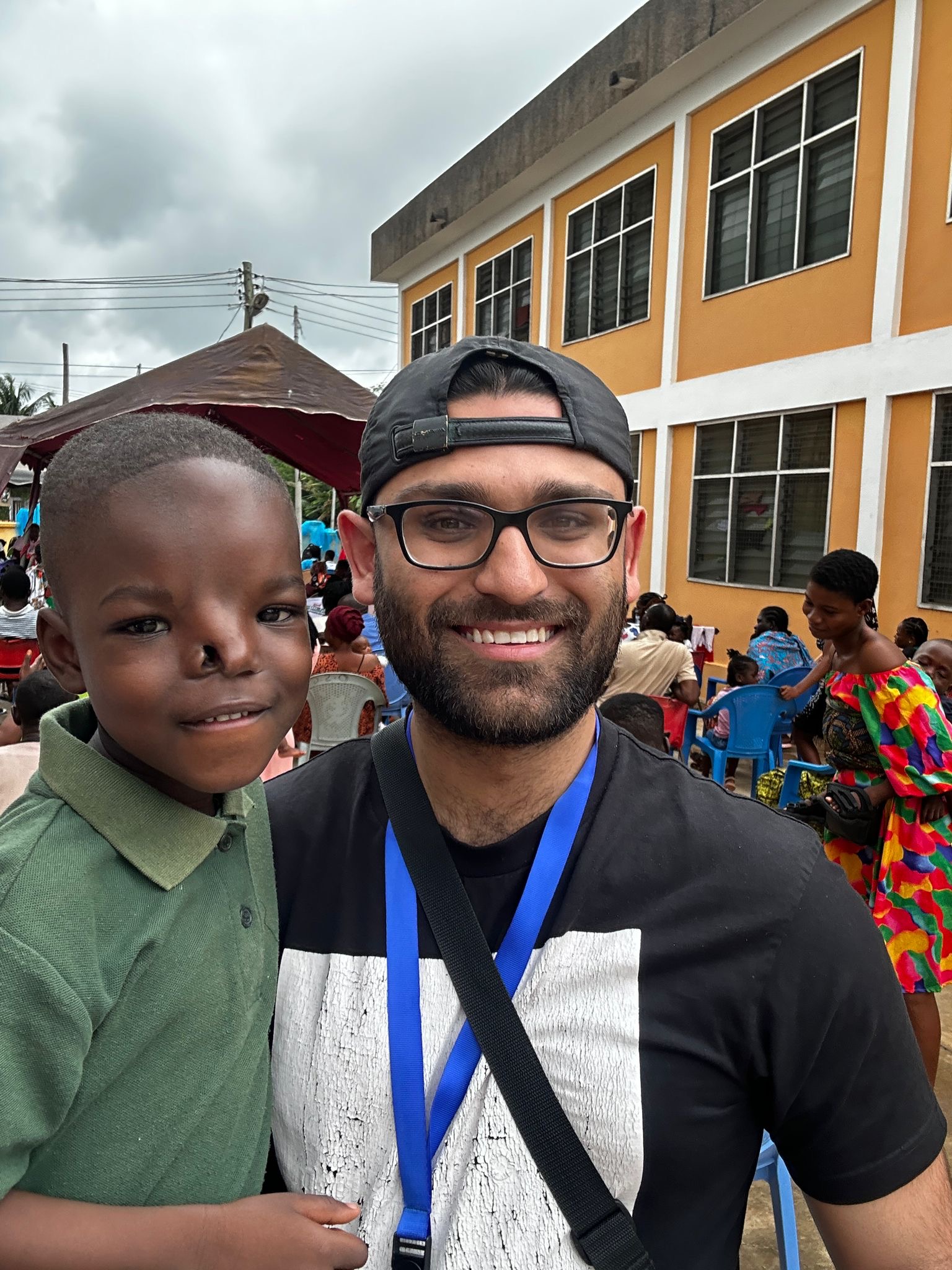 Rahil with one of the children at the Operation Smile Ghana selection day.